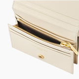 L-quilting en cuir bifold demi-portefeuille
